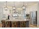 Modern kitchen with an island, stainless appliances, and white cabinets for a clean look at 528 Sandbar Pt, Clover, SC 29710