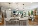 Open-concept kitchen with island sink overlooking the dining and living areas at 528 Sandbar Pt, Clover, SC 29710
