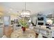 Open-concept kitchen and living area with modern lighting and hardwood floors at 528 Sandbar Pt, Clover, SC 29710