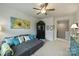 Bright living room with a gray couch, ceiling fan, and stylish decor at 528 Sandbar Pt, Clover, SC 29710