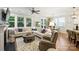 Bright and airy living room with large windows and comfortable seating arrangement at 528 Sandbar Pt, Clover, SC 29710