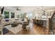 Bright living space with hardwood floors, a cozy seating area, and a modern kitchen with an island at 528 Sandbar Pt, Clover, SC 29710