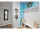 Welcoming mudroom features a bench with storage, coat hooks, and decorative wreath at 528 Sandbar Pt, Clover, SC 29710