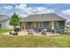 Back patio area with outdoor seating, grill, and stylish furnishings at 528 Sandbar Pt, Clover, SC 29710