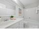 Clean white bathroom features a vanity, shower, and soaking tub at 5308 Sunningdale Dr, Charlotte, NC 28277