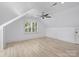 Spacious bonus room with high ceilings, a fan, and a window with shutters at 5308 Sunningdale Dr, Charlotte, NC 28277
