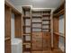 Custom closet with natural wood shelves, drawers, and hanging storage at 5308 Sunningdale Dr, Charlotte, NC 28277
