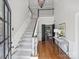 Bright foyer with a soaring staircase, hardwood floors, and elegant chandelier at 5308 Sunningdale Dr, Charlotte, NC 28277