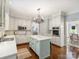 Spacious eat-in kitchen with an island, stainless steel appliances, and adjacent dining area at 5308 Sunningdale Dr, Charlotte, NC 28277