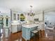 Charming eat-in kitchen with a center island, pendant lighting, and modern appliances at 5308 Sunningdale Dr, Charlotte, NC 28277
