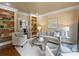 Inviting living room featuring custom wine storage, fireplace access and stylish decor at 5308 Sunningdale Dr, Charlotte, NC 28277