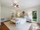 Bright main bedroom with hardwood floors, ceiling fan and ensuite bathroom access at 5308 Sunningdale Dr, Charlotte, NC 28277