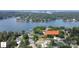 Stunning aerial view of lakefront property with lush greenery and serene waters; the perfect waterfront oasis at 554 Isle Of Pines Rd, Mooresville, NC 28117