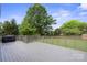 Open back deck overlooking a grassy yard and mature trees at 554 Isle Of Pines Rd, Mooresville, NC 28117