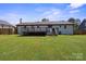 Spacious backyard featuring a lovely deck, perfect for outdoor entertaining at 554 Isle Of Pines Rd, Mooresville, NC 28117