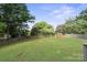 Large, fenced backyard with a spacious green lawn, ready for outdoor activities at 554 Isle Of Pines Rd, Mooresville, NC 28117