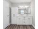 Bright bathroom features double vanity, storage cabinet, and modern fixtures at 554 Isle Of Pines Rd, Mooresville, NC 28117