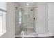 Modern bathroom with glass shower door, subway tile, and bronze shower fixture at 554 Isle Of Pines Rd, Mooresville, NC 28117