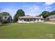 Charming single-story home with a well-kept lawn and inviting curb appeal at 554 Isle Of Pines Rd, Mooresville, NC 28117