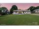 Charming single-story home with a well-manicured lawn at sunset at 554 Isle Of Pines Rd, Mooresville, NC 28117