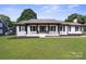 Beautiful single-story home with a manicured lawn and welcoming entrance at 554 Isle Of Pines Rd, Mooresville, NC 28117