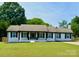 Charming ranch-style home with a well-manicured lawn and a welcoming front entrance at 554 Isle Of Pines Rd, Mooresville, NC 28117