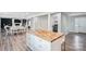 Kitchen island features a wood countertop and plenty of storage at 554 Isle Of Pines Rd, Mooresville, NC 28117