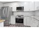 Kitchen features stainless appliances, granite countertops, and white subway tile backsplash at 554 Isle Of Pines Rd, Mooresville, NC 28117