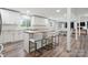 Modern kitchen with white cabinetry, stylish island seating, and ample counter space at 554 Isle Of Pines Rd, Mooresville, NC 28117