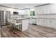 Contemporary kitchen featuring stainless steel appliances, island, and ample storage at 554 Isle Of Pines Rd, Mooresville, NC 28117