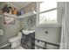 Cozy bathroom featuring a vanity, toilet, window, decor, and shelving at 622 University Dr, Rock Hill, SC 29730