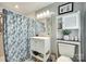 Well-lit bathroom with modern vanity, patterned shower curtain, and sleek fixtures at 622 University Dr, Rock Hill, SC 29730