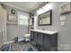 Stylish bathroom featuring patterned floors, vanity, toilet, window, and decor at 622 University Dr, Rock Hill, SC 29730