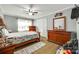 Bedroom with hardwood floors, ceiling fan, and ample storage in a stylish home at 622 University Dr, Rock Hill, SC 29730