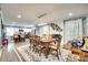 Elegant dining room with a large table, stylish rug, and open access to the kitchen at 622 University Dr, Rock Hill, SC 29730