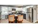 Modern kitchen with granite countertops, stainless steel appliances, and a stylish island with seating at 622 University Dr, Rock Hill, SC 29730