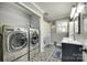 Well-equipped laundry room with modern washer and dryer, and patterned tile flooring at 622 University Dr, Rock Hill, SC 29730