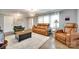 Inviting living room featuring plush seating, a modern light fixture, and ample natural light at 622 University Dr, Rock Hill, SC 29730