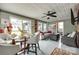 Comfortable living room with ceiling fan, table, chairs, and cozy seating area at 622 University Dr, Rock Hill, SC 29730