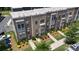 Aerial view of new townhomes with brick, gray accents, landscaped yards, and parking at 625 Uwharrie River Rd, Charlotte, NC 28211