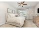 Calm bedroom featuring a plush bed, soft lighting, and neutral decor at 625 Uwharrie River Rd, Charlotte, NC 28211