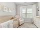 Charming Bedroom with a crib, glider, and dresser bathed in soft natural light at 625 Uwharrie River Rd, Charlotte, NC 28211