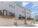 Rear view of townhomes with garages and decks or balconies at 625 Uwharrie River Rd, Charlotte, NC 28211