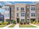 Modern brick townhome featuring gray accents, well-maintained landscaping and inviting entrance ways at 625 Uwharrie River Rd, Charlotte, NC 28211