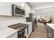 Contemporary kitchen features stainless steel appliances, white cabinets, and an open layout at 625 Uwharrie River Rd, Charlotte, NC 28211