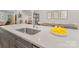 Kitchen island with stainless steel sink and seating area, overlooking the dining space at 625 Uwharrie River Rd, Charlotte, NC 28211