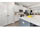 Well-equipped kitchen with white cabinets, stainless steel appliances, and an island with bar seating at 625 Uwharrie River Rd, Charlotte, NC 28211