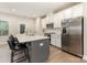 Modern kitchen with stainless steel appliances, white cabinetry, and a spacious island with seating at 625 Uwharrie River Rd, Charlotte, NC 28211