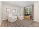 Inviting living room featuring neutral walls, wood floors, natural light, and comfortable seating at 625 Uwharrie River Rd, Charlotte, NC 28211
