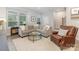 Comfortable living room featuring neutral tones, a sectional sofa, and a cozy reading chair at 625 Uwharrie River Rd, Charlotte, NC 28211